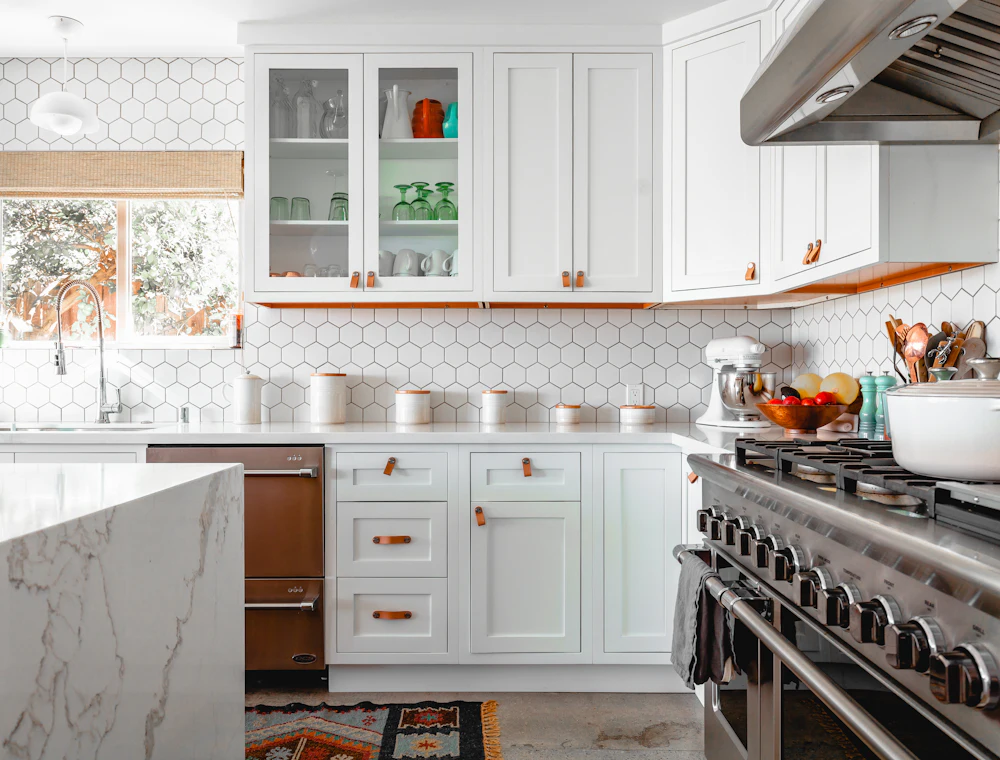 Clean white kitchen with hexagon tiles